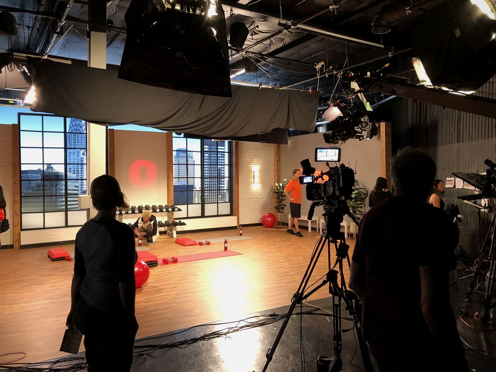 Studio production in action with crew, cameras, and lighting